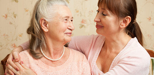 Senior woman with their caregiver at home